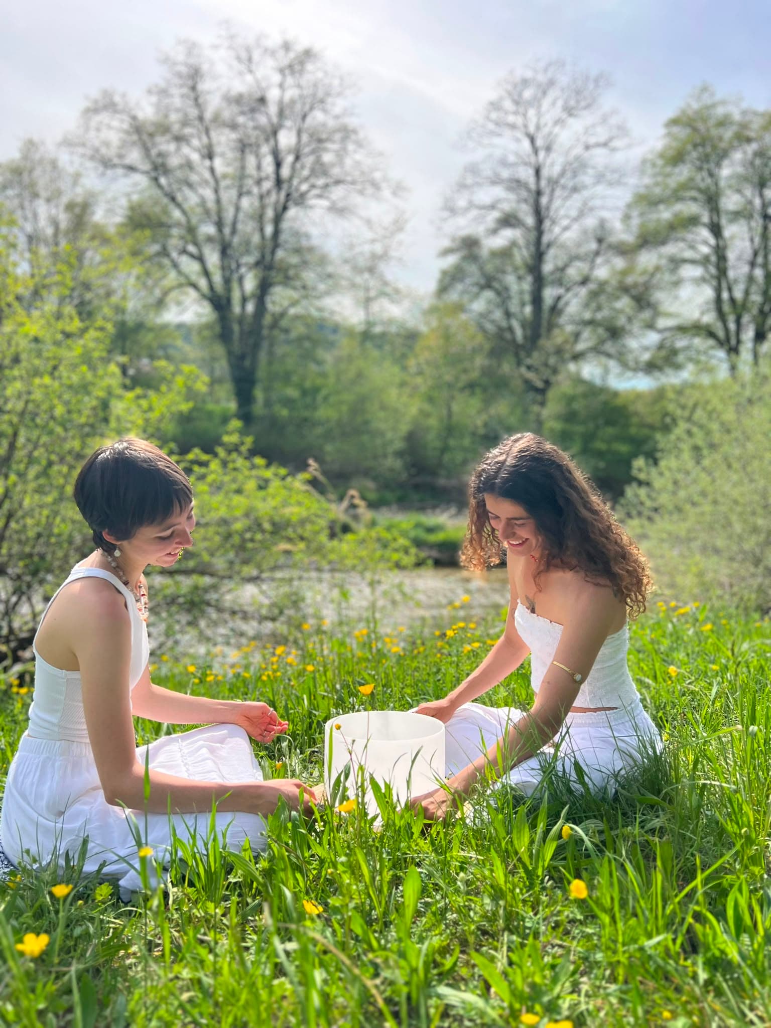 Two women sharing a mindful practice outdoors