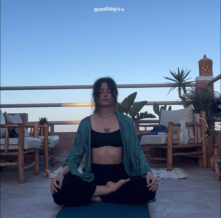 Elisa meditating outdoors